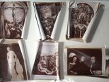 many old photos hanging on the wall of a room
