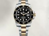 a close up of a watch on a white background with a black dial