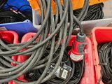 many different types of hoses and other items in the bins