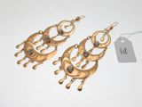 two pairs of gold tone earrings with crystals on them