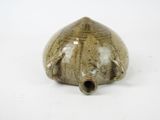 an image of a ceramic object on a white surface