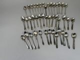 a lot of spoons and spoon spoons sitting on a table