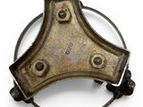 a metal object that is sitting on a white surface