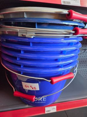 several buckets of blue and red are stacked on top of each other