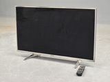 a television and a remote sitting on the floor