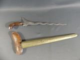 a knife and a hammer sitting on a table