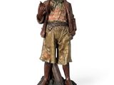 bronze statue of a man with a hat and jacket on a rock