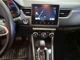 the interior of a car with a steering wheel, dashboard, and display screen