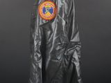 the back of a black leather jacket with a patch on it