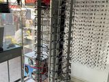 many glasses on display in a store with a lot of them