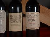 three bottles of wine sitting next to each other on a table