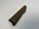 a small piece of metal on a white surface