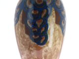 a brown vase with a blue and brown design on it