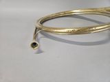 gold plated brass bang bracelet with a small bell