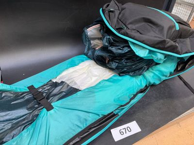 a sleeping bag that is sitting on a bench