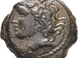 un gros plan d'une pièce de monnaie avec un visage dessus