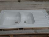 a white sink sitting on top of a pallet