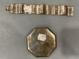 a close up of a metal object with a tag on it