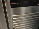 a stainless steel oven that is open and ready to be used
