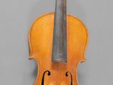 an old violin with a bow on a gray background