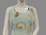 a mannequin wearing a top with a design on it