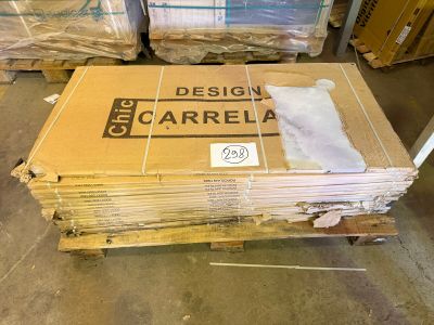 a large stack of boxes sitting on a pallet in a warehouse