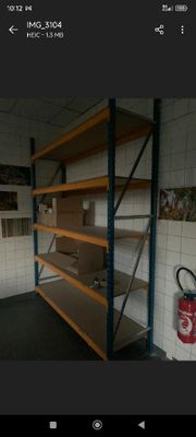 a picture of a room with shelves and a fire extinguisher