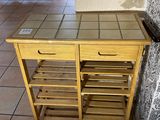 an image of a kitchen cart on a tiled floor