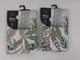 two pairs of white socks with green leaves on them