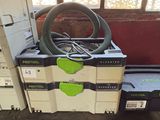 a stack of boxes and a hose on a cart