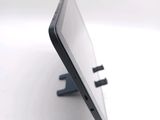 a close up of a cell phone that is on a stand
