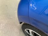 a close up of a car ' s tire with a sticker on it
