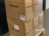 two boxes are stacked on a pallet in a warehouse