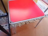 a red table with a metal frame on it