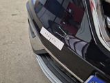 a close up of a car with a sticker on the front of it