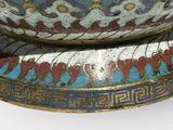 a large bowl with a design on it sitting on a pedestal