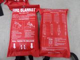 two red fire blankets on the floor next to each other