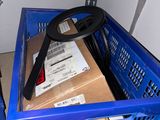a blue crate with a steering wheel in it and a blue crate with a steering wheel in it