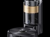 une image représentant une cafetière noire et dorée sur fond noir