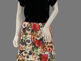 a mannequin wearing a skirt with flowers on it
