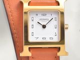 an image of a close up of a wrist watch on a white surface