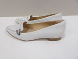 the shoe is white and has a bow on the side