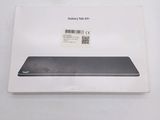 the back of a box with a phone inside of it on a table