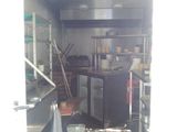 a kitchen with a lot of counter space in the back of the truck