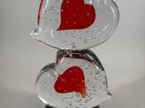a glass sculpture of two hearts on top of each other