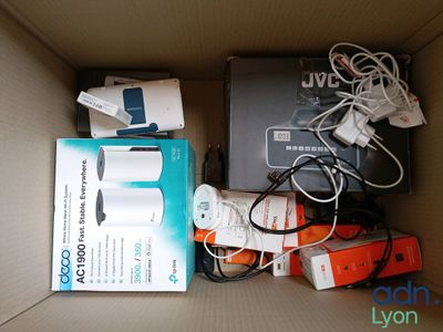 a box full of electronic devices and wires in it