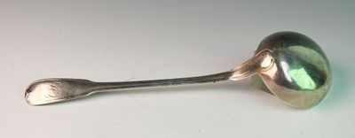 a spoon with a spoon handle on a white surface