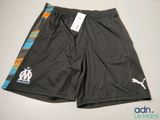 a close up of a soccer shorts with a tag on it