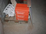 a stack of boxes sitting on a pallet in a room