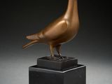 an image of a bronze bird on a black marble base